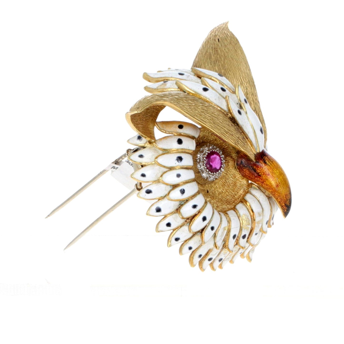 Angled view of handcrafted 18K gold owl brooch highlighting enamel feathers and ruby-set eyes.
