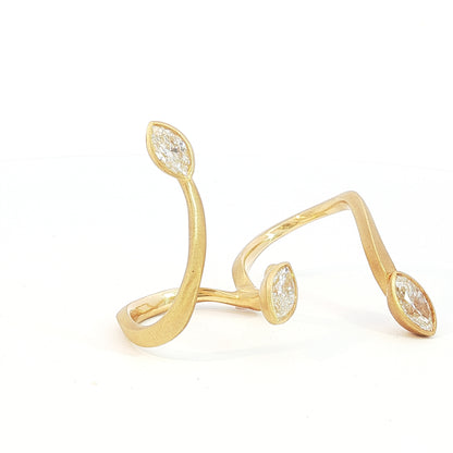 Avant-garde 18k matte yellow gold open-shank ring with 1.53ctw marquise diamonds worn across fingers size 7 by Kantor Gems