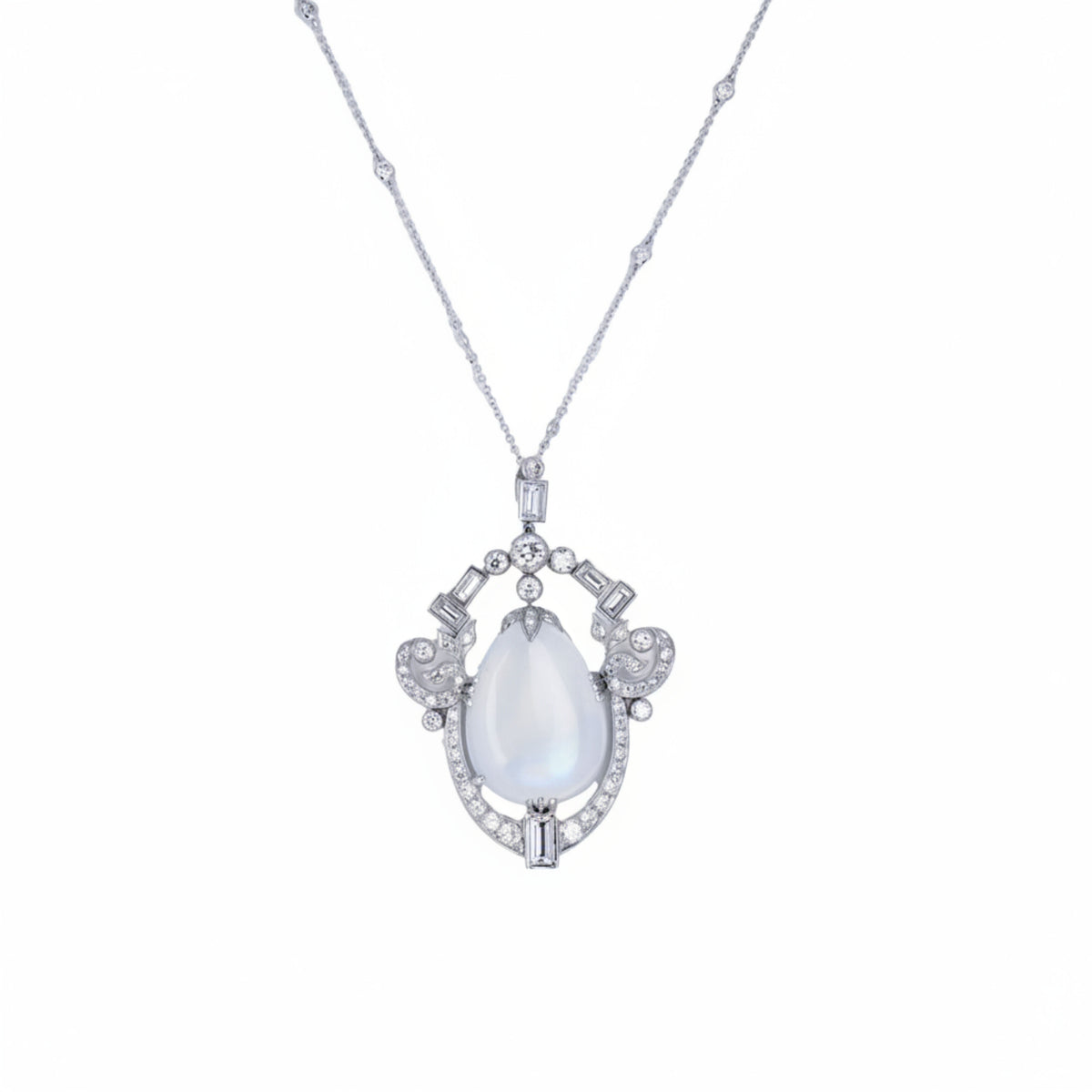 platinum pendant necklace featuring a pear-shaped cabochon moonstone framed by 2.75 CTW of baguette & round diamonds. 11.13 grams.