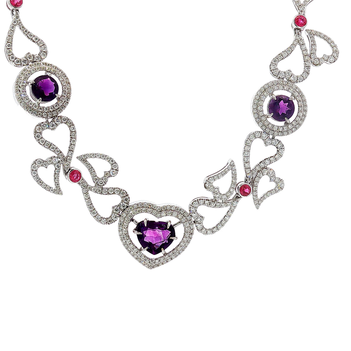 14K white gold heart necklace featuring 14.45 carats of amethysts and 9.00 carats of diamonds in an intricate openwork design.