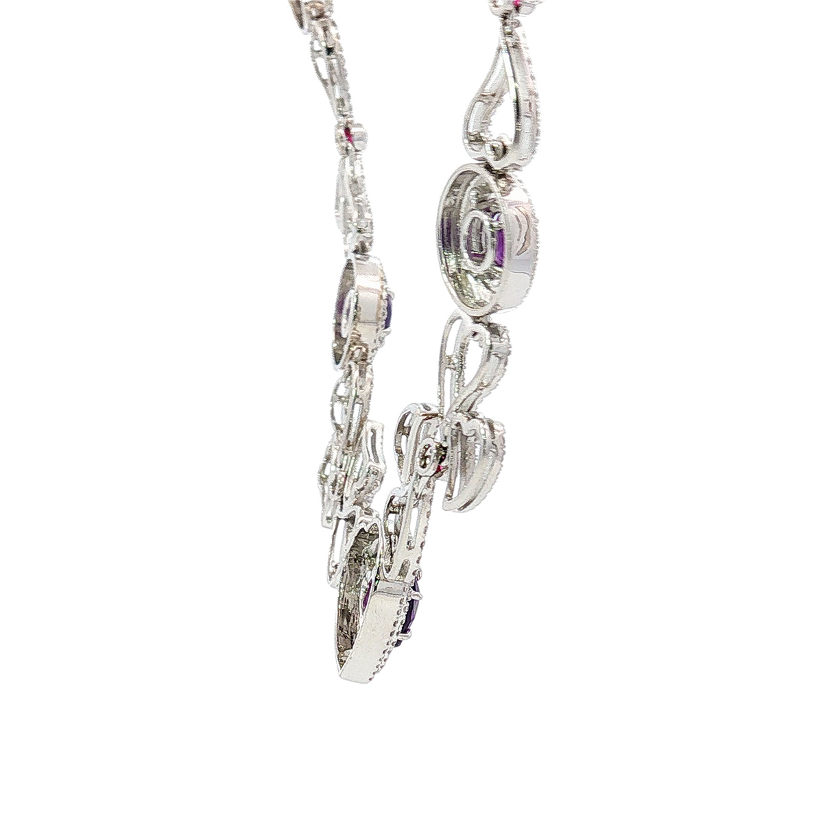 14K white gold heart necklace featuring 14.45 carats of amethysts and 9.00 carats of diamonds in an intricate openwork design.