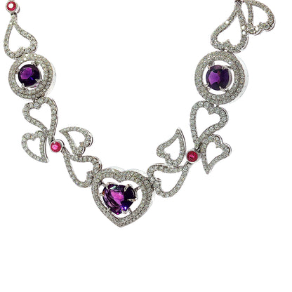 14K white gold heart necklace featuring 14.45 carats of amethysts and 9.00 carats of diamonds in an intricate openwork design.