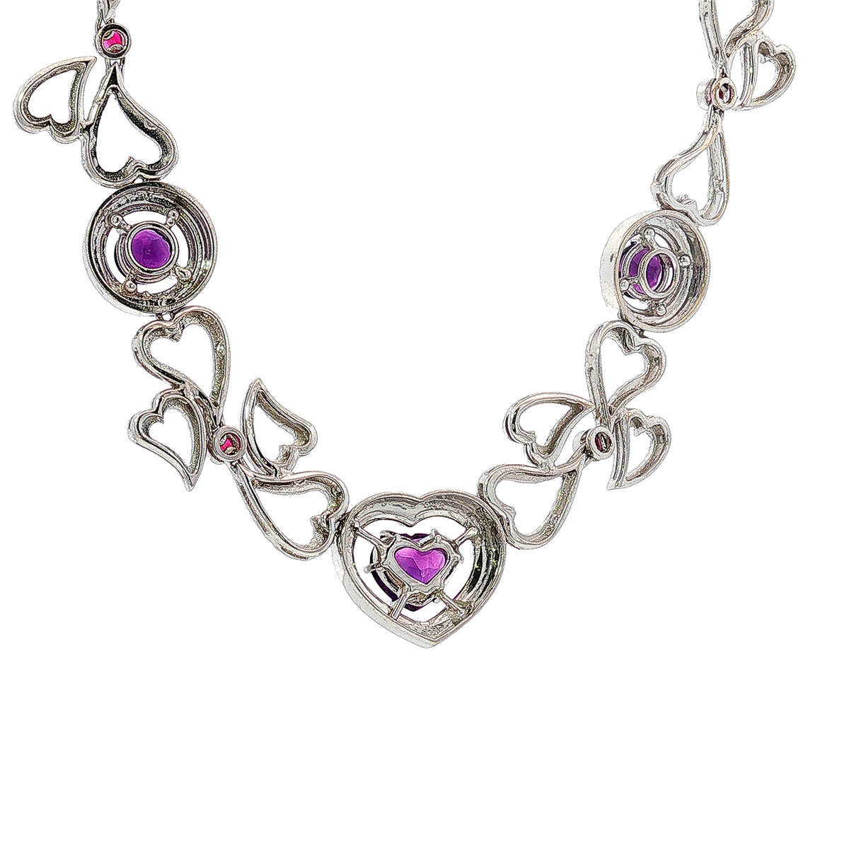 14K white gold heart necklace featuring 14.45 carats of amethysts and 9.00 carats of diamonds in an intricate openwork design.