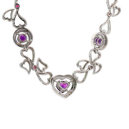 14K white gold heart necklace featuring 14.45 carats of amethysts and 9.00 carats of diamonds in an intricate openwork design.