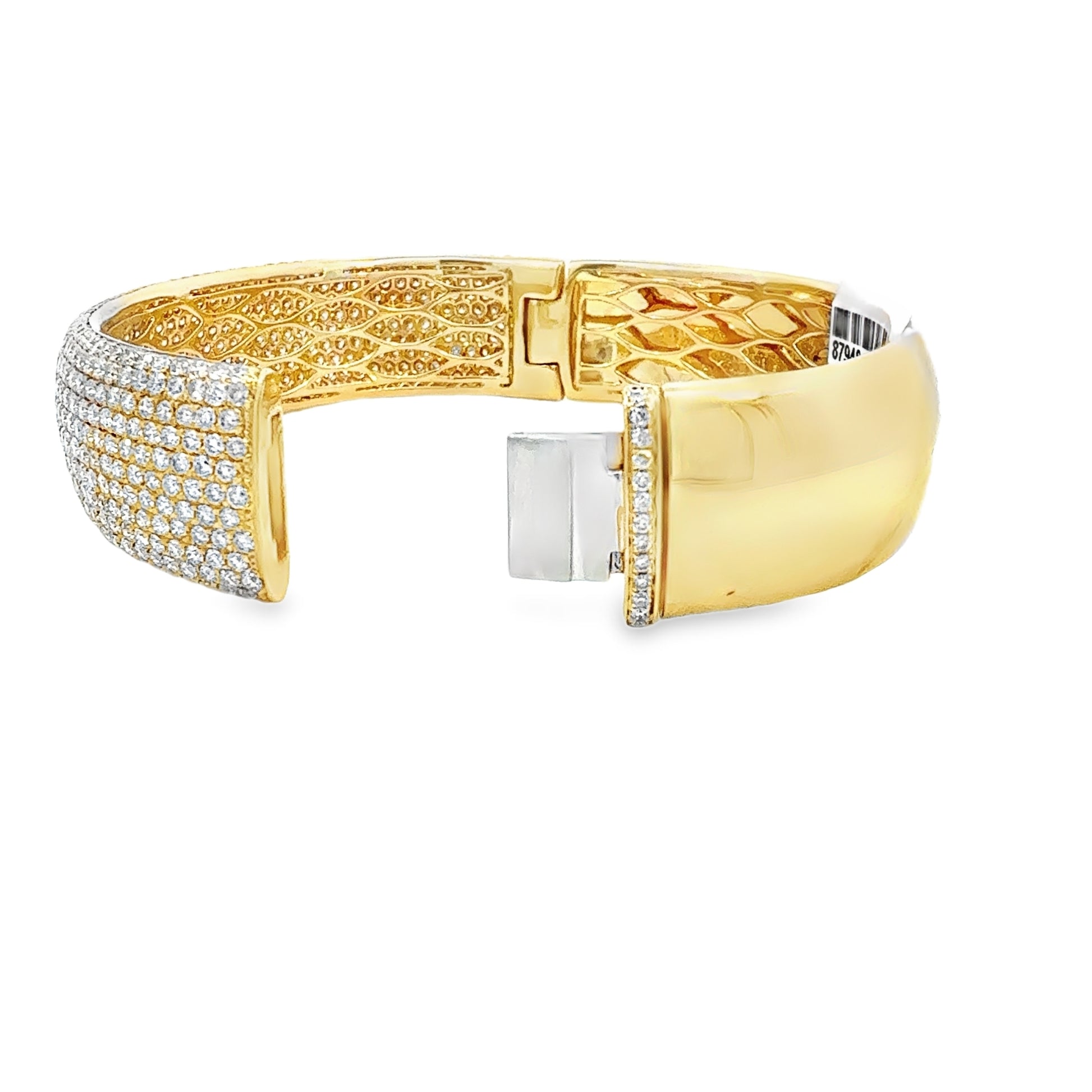 Gold bracelet with diamond accents on a white background