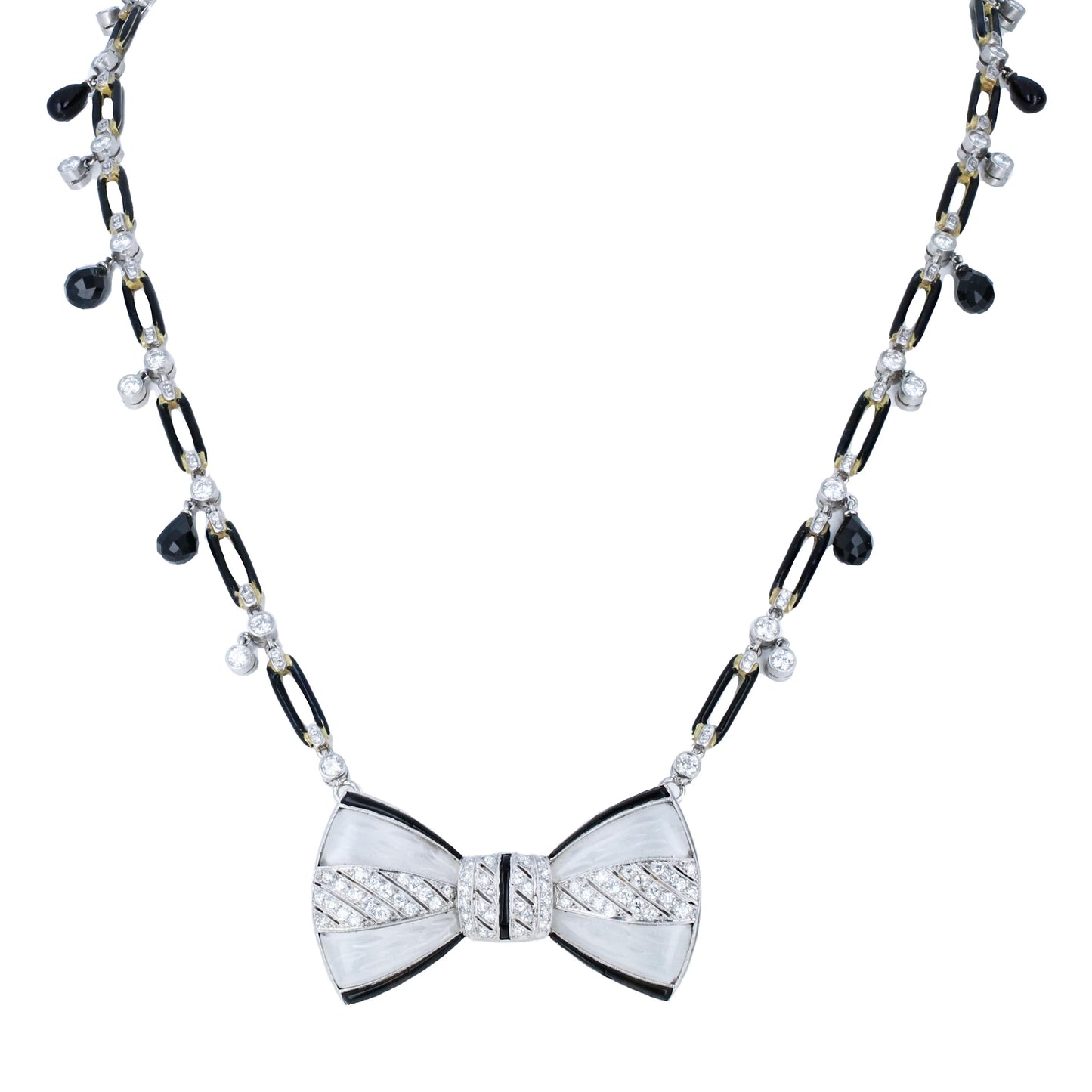 Fred Leyton 18K gold necklace with rock crystal bow pendant, black onyx links, bezel-set diamonds, and briolette black diamond drops.
