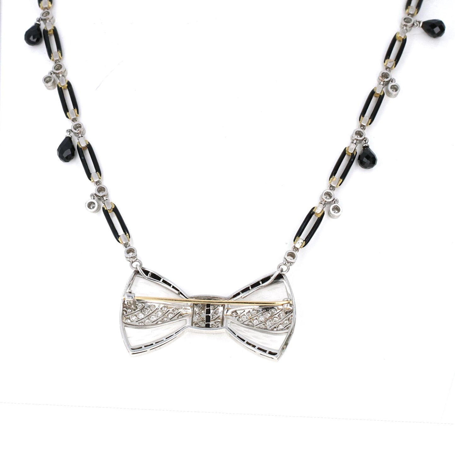 Reverse of Fred Leyton diamond and onyx bow brooch showing fine craftsmanship, signed, convertible Art Deco revival design.