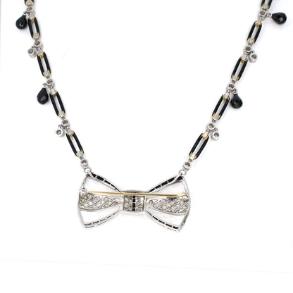 Reverse of Fred Leyton diamond and onyx bow brooch showing fine craftsmanship, signed, convertible Art Deco revival design.