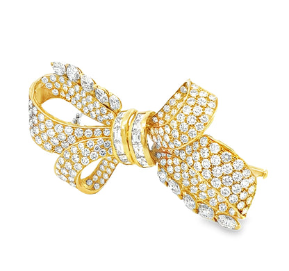 Vintage 18K yellow gold Retro diamond bow brooch featuring 238 round brilliant, pear-shaped, and baguette-cut diamonds totaling approximately 19.50 carats.