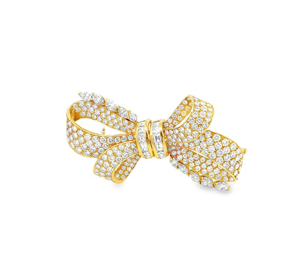 Vintage 18K yellow gold Retro diamond bow brooch featuring 238 round brilliant, pear-shaped, and baguette-cut diamonds totaling approximately 19.50 carats.