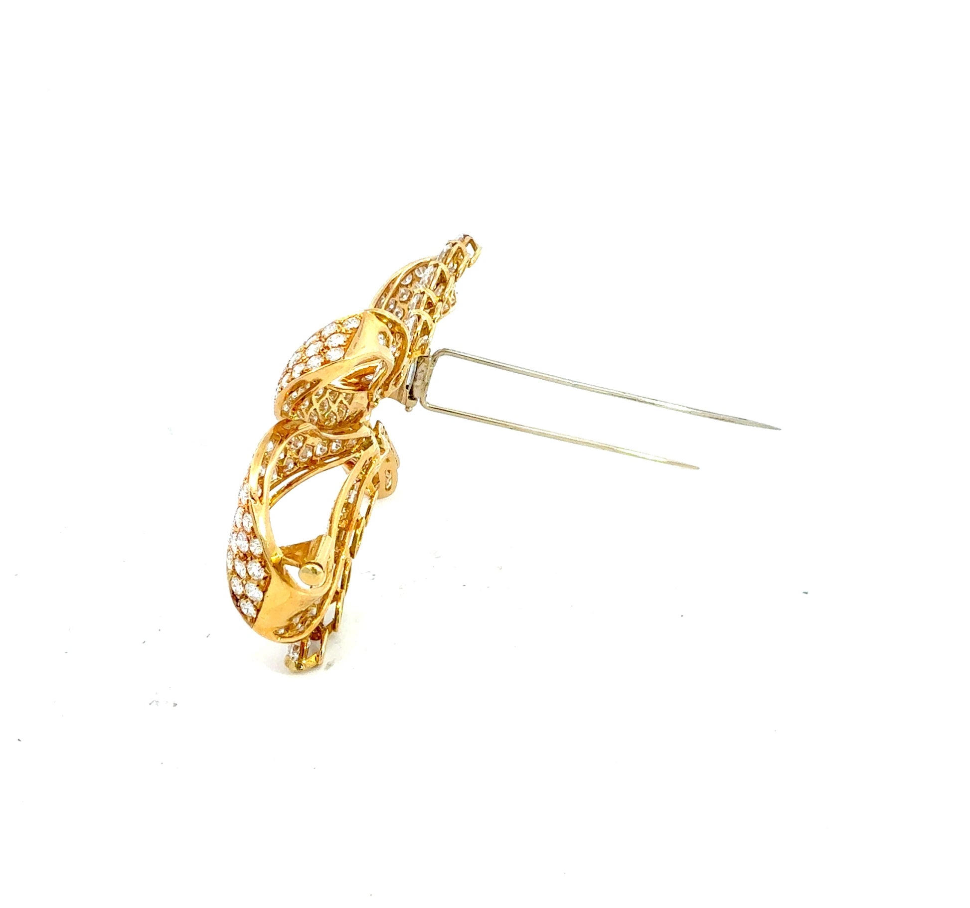 Vintage 18K yellow gold Retro diamond bow brooch featuring 238 round brilliant, pear-shaped, and baguette-cut diamonds totaling approximately 19.50 carats.