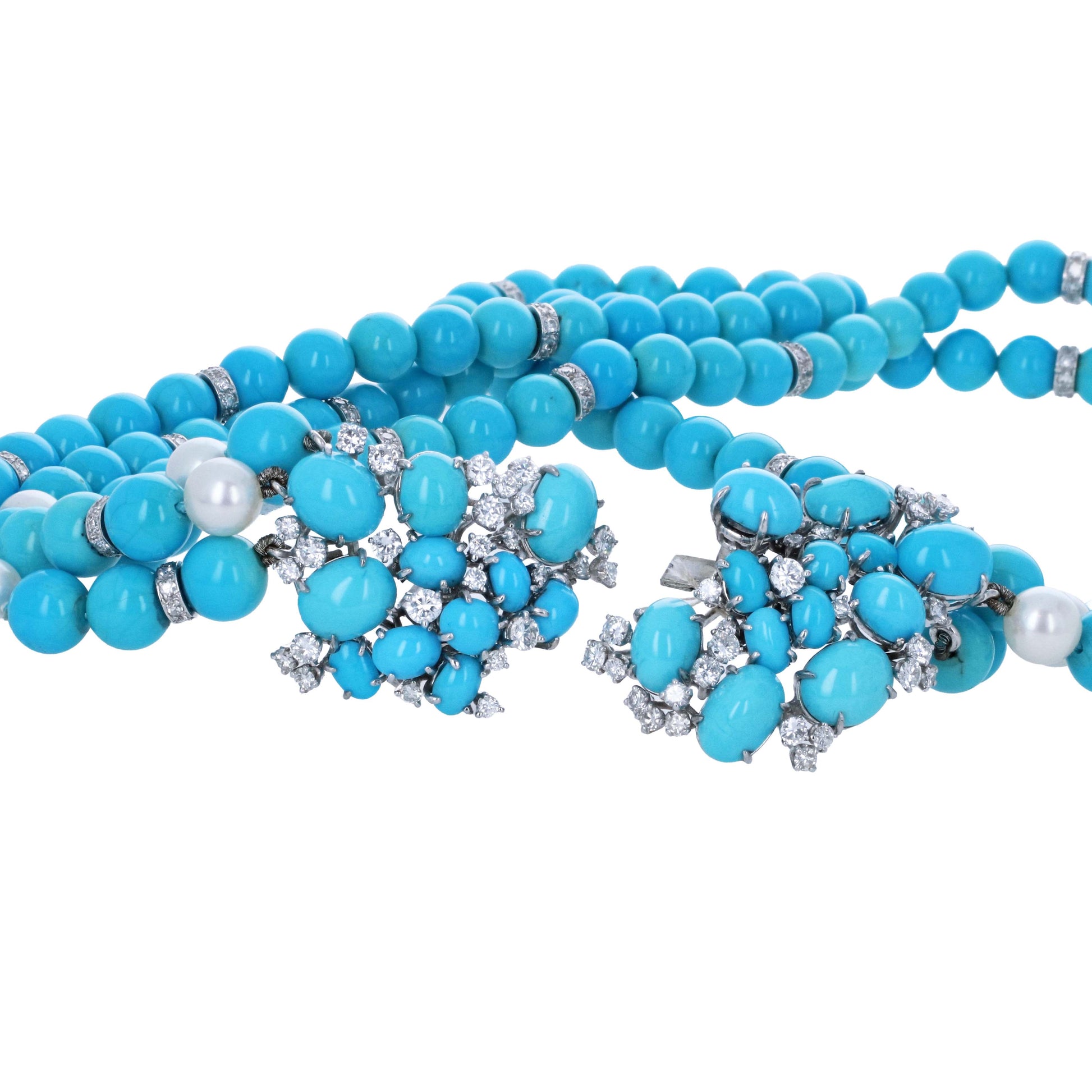 meister-swiss-18k-turquoise-diamond-pearl-necklace-earring-suite A turquoise beaded necklace with silver-toned metal settings and white pearl accents, displayed on a clean white background.