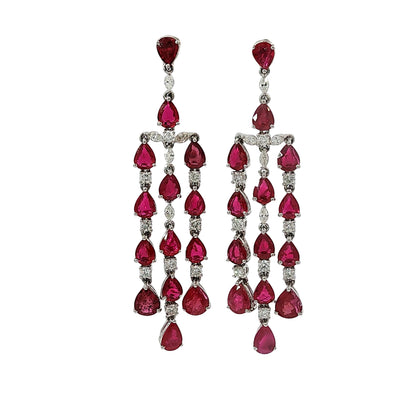 Pear shape ruby and diamond chandelier dangle earrings in 18 karat white gold with 9.98 carats of natural rubies and 1.02 carats of diamonds.