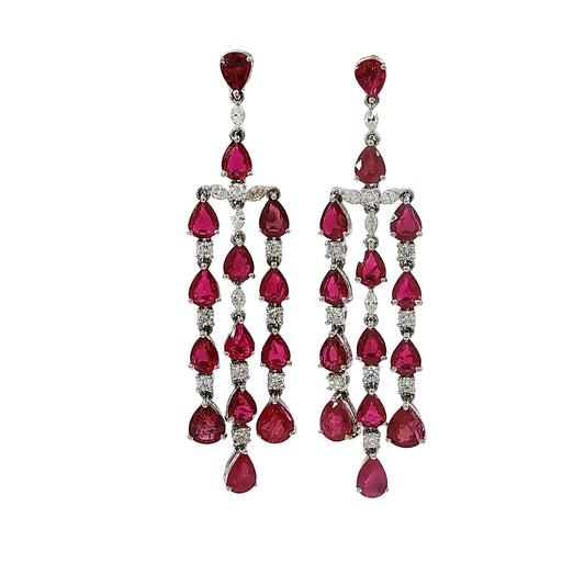 Pear shape ruby and diamond chandelier dangle earrings in 18 karat white gold with 9.98 carats of natural rubies and 1.02 carats of diamonds.