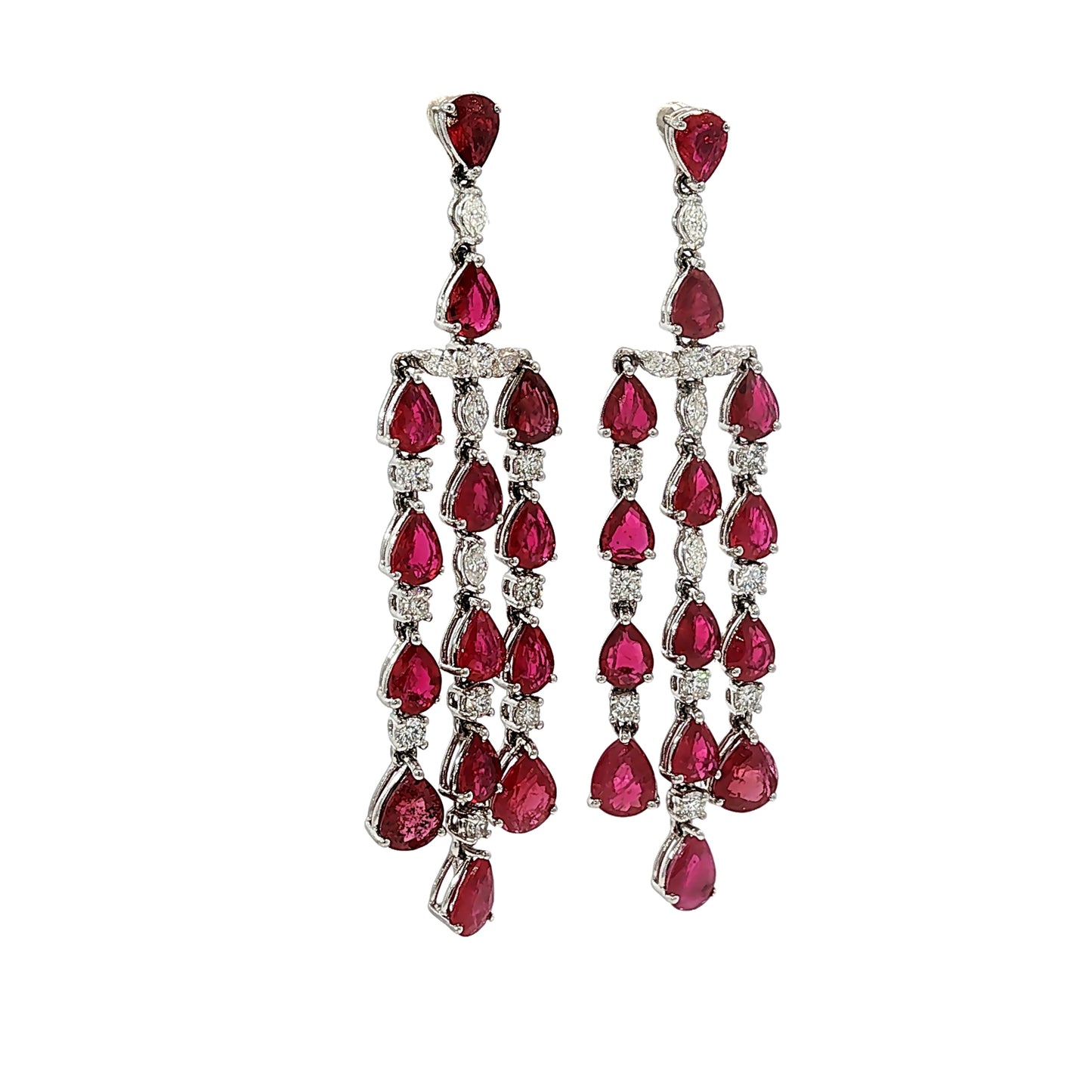 Side profile of 18 karat white gold articulated ruby and diamond chandelier earrings showing open gallery construction and pear-shaped rubies.
