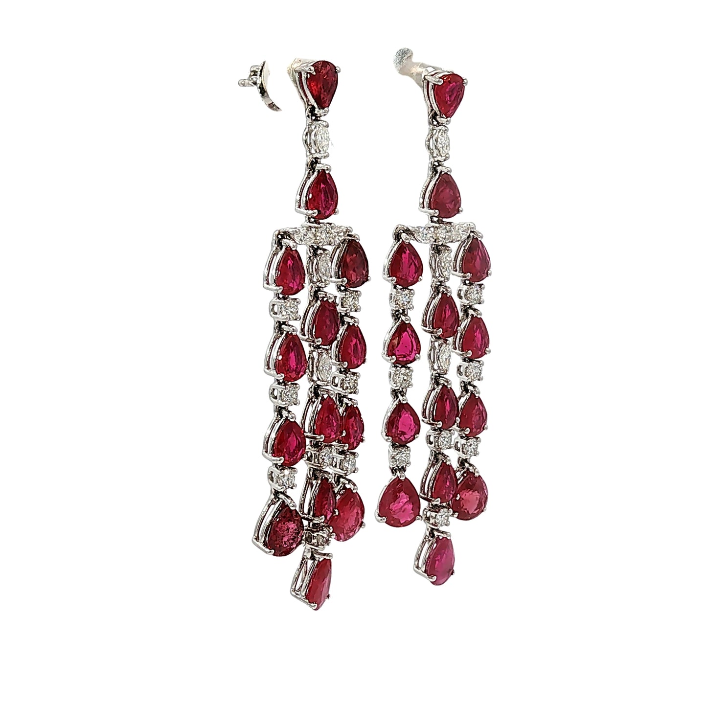 Side profile of 18 karat white gold articulated ruby and diamond chandelier earrings showing open gallery construction and pear-shaped rubies.