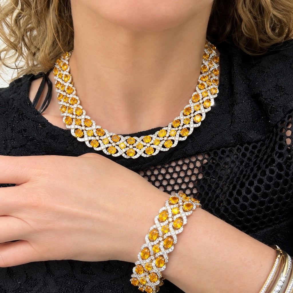 89.00 CTW Oval Orange Sapphire & 19.53 CTW Diamond Interwoven Necklace and Bracelet Suite in 18K Yellow Gold
