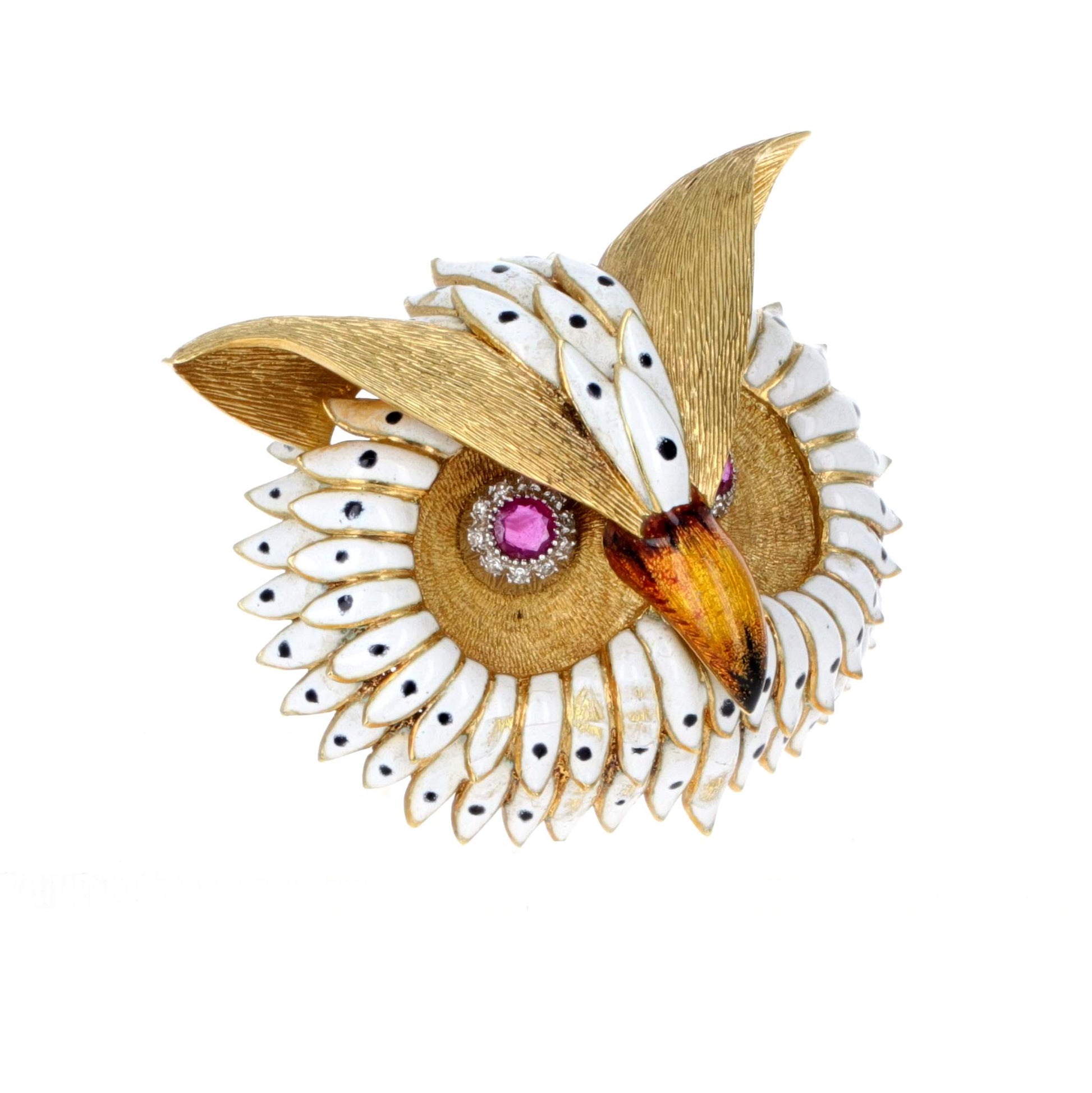 Angled view of handcrafted 18K gold owl brooch highlighting enamel feathers and ruby-set eyes.