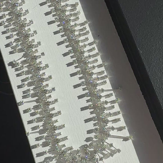 15.50 carat round brilliant diamond fringe chandelier necklace in 18K white gold featuring articulated geometric bars and graduated diamond drops.